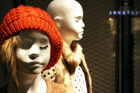 Two faces of child mannequins in the windowの写真素材