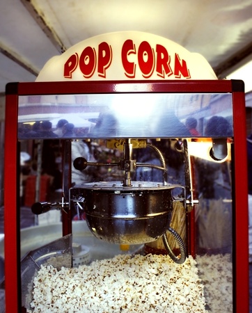 A popcorn machine with the sign lightの写真素材