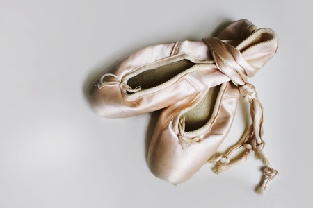 A pair of ballet slippers in light gray backgroundの写真素材