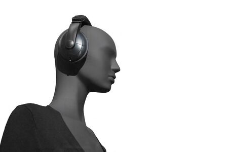 Detail of a female mannequin profile with earphones on white backgroundの写真素材