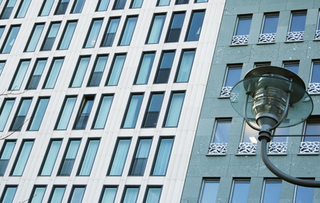 Details of two facades of modern buildings and a detail of a street lampの写真素材