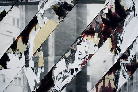 A close up to a torn poster obliquely