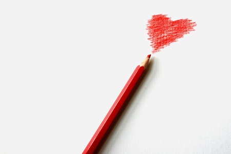 Photo of a red pencil with heartの写真素材