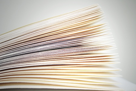 Photo detail of sheets of an open book on the grey light backgroundの写真素材