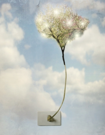 Artistic concept of a plug of light with the wire that becomes a treeの写真素材