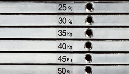 Abstract detail of weight stack with equivalent in kilogramsの写真素材