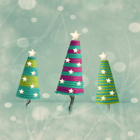 Three beautiful colorful cones shape Christmas treesの写真素材