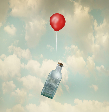 A surreal image of a glass with a stormy seaの写真素材