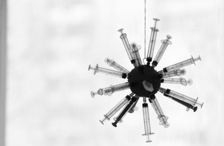 syringes in the form of a virus on a white backgroundの写真素材