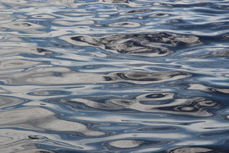 Blue water ripples on the surface of the sea as a backgroundの写真素材