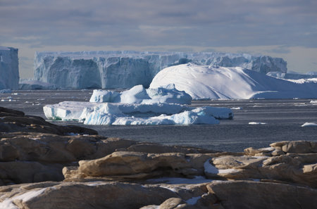 Antarctic landscape with icebergs and icebergs in the ocean