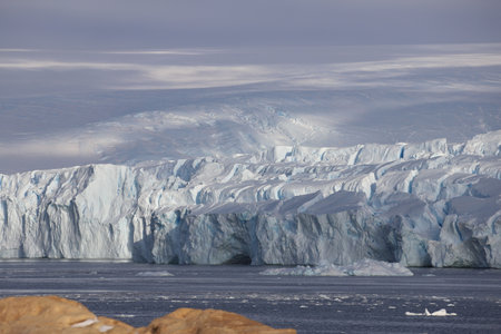 beautiful clear blue and white glacier in Antarctica on the coast near the Progress station