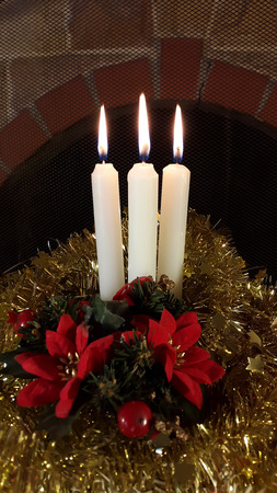 Christmas decoration three candles with tiselの写真素材