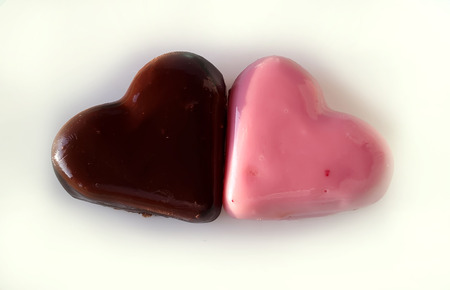 Two Sweet Colorful Marzipan heart candy isolated on white backgroundの写真素材