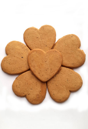 Fresh baked Biscuits hearts on a white backgroundの写真素材