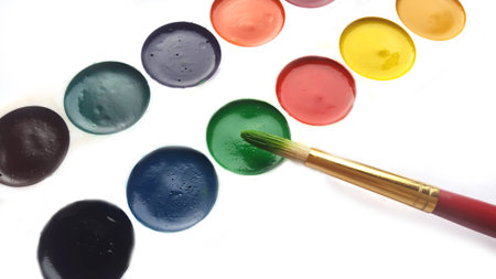 Painter's palette and brush on white backgroundの写真素材