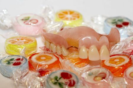 Dental artificial limb, sweets, caries, a jawの写真素材