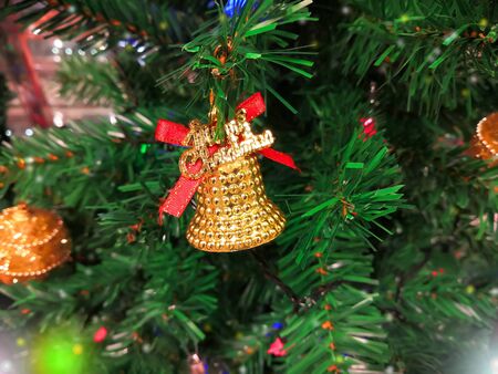 Beautiful Christmas tree decorated with lights and ornaments as a part of Christmas festivitiesの写真素材