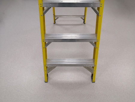 Yellow Aluminum Fordable Step Ladder. Selective Focus