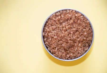 Kerala Special Matta Rice In Yellow Background. Selective Focusの写真素材