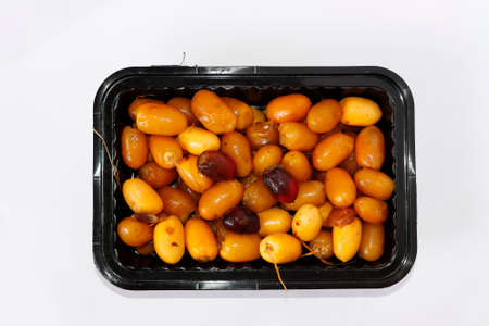 Arabic Fresh Yellow And Red Date Fruits In A Black Square Plate. White Background