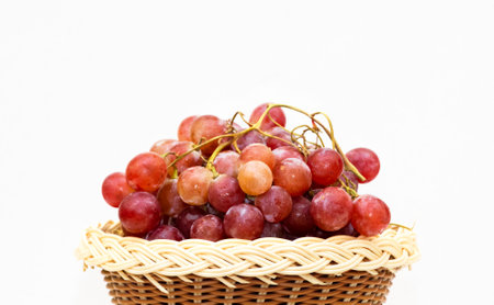 Closeup Image Of Red Grape fruits In White Backgroundの写真素材