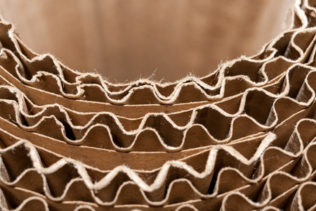 Close-up semicircular wavy edges of layers of corrugated cardboard. Top view.の写真素材