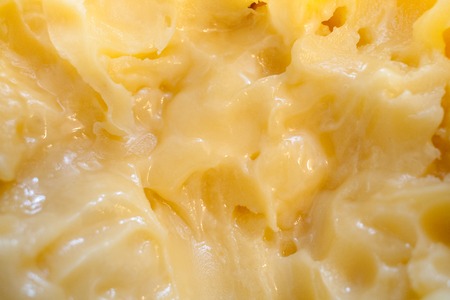 Natural homogeneous viscous texture of yellow flower honey.
