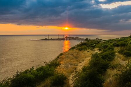 A majestic seascape with colorful sunset. Toned image.の写真素材