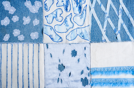 Textile background from square samples of hand-made fabrics.の写真素材