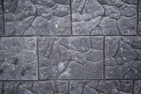 Close-up of gray wall of large stone slabs.の写真素材