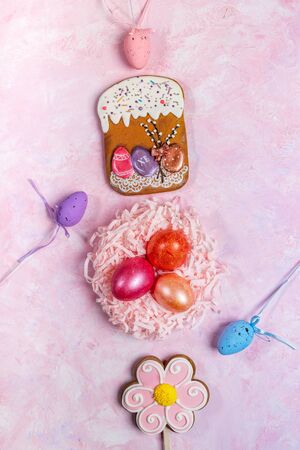 Easter festive vertical background with colored eggs in decorative nest and ornamental Easter eggs,...