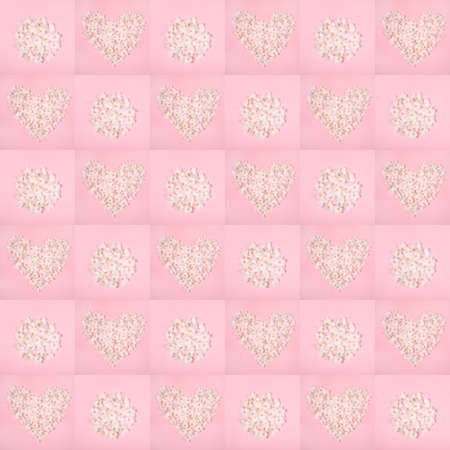 Festive floral seamless pattern of pink squares with shapes heart and circle laid out from white apple tree flowers. Holiday Mother's day, Valentine's Day, Wedding backdrop. Top view, flat lay.の写真素材