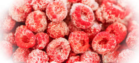 Frozen organic raspberry in white frosty frame. Frozen berries retain all vitamins. Freezing berries are healthy preparations for winter. natural backdrop. Banner. top view. selective focus. close up.の写真素材