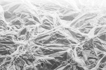 Interesting texture of white melted polyethylene on gray background. Fantasy pattern with different illumination. Unusual background or wallpapers. selective focus. Horizontal orieの写真素材