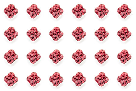 Seamless pattern of frozen berries on white background. Frozen organic raspberry in white bowls on...