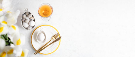 Easter table setting banner. Festive elegant white with yellow restaurant table serving. Figured...