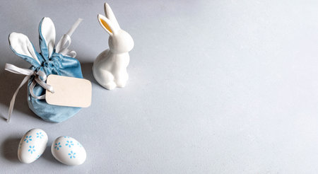 Creative gift bag with bunny ears, blank note, white ceramic bunny, decorative eggs with floral...
