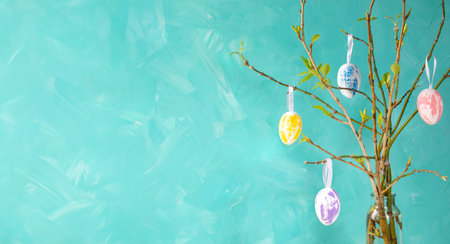Holiday card template. Easter tree on turquoise background. Decorative pastel color eggs hanging on...