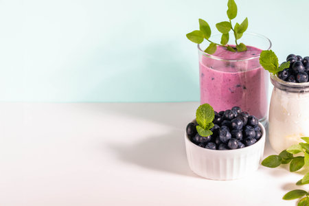 Healthy blueberry nutrient-rich smoothie with natural yogurt and fresh blueberries. Smoothie with natural yogurt for probiotic effect. Superfood, antioxidant ideal for fitness diet. Copy space.の写真素材