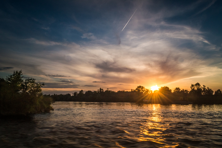The largest river in Poland at sunsetの写真素材