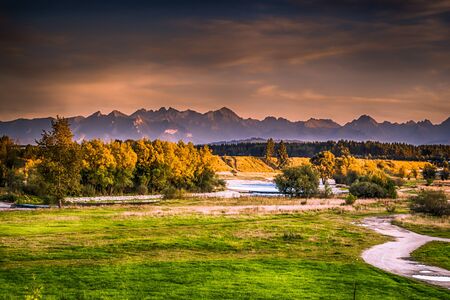 View of the Czarny Dunajec river and distant mountains.