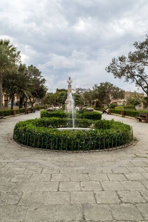 Narrow street surrounded by old tenement houses, Malta.の写真素材