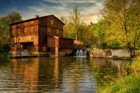 A historic water mill in Brzeski on the Grabia River in central Poland.の写真素材