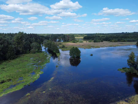 Flight over the small river in the center of Poland.の写真素材