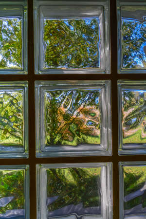 Background of sun-lit glass tiles.