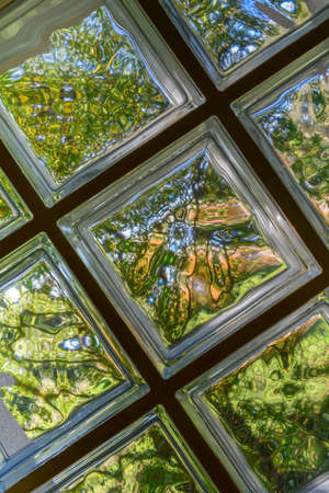 Background of sun-lit glass tiles.