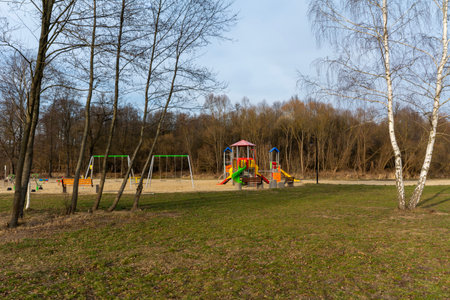 Children's playground in the park on a spring or autumn day.