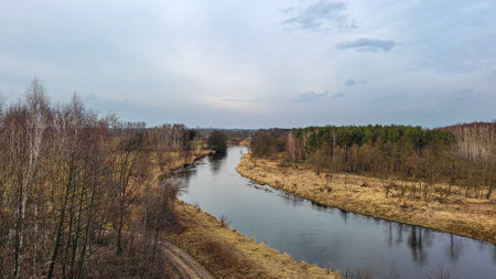 River and forest in the early spring. Early spring in Russia.