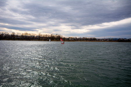 Skiing on the lake in the early spring on a cloudy dayの写真素材